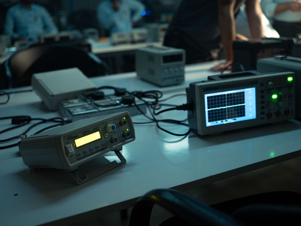 Electronics lab with oscilloscopes on desks